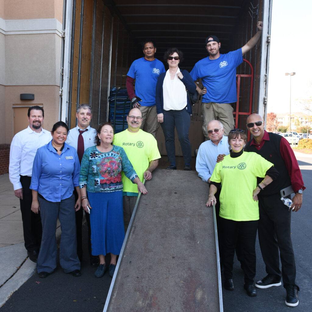 group at moving truck ramp