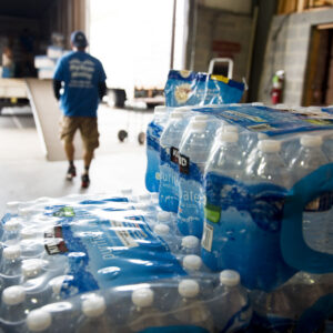 mover loading water on truck