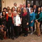 dulles area association of realtors gathered together for a large photo at the holiday park