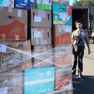 Talan standing by moving pallet