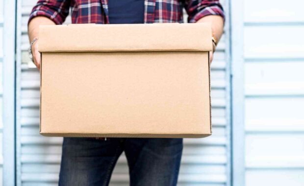 man holding storage box