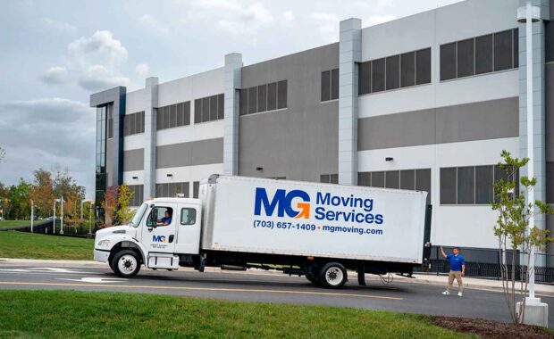 MG Moving Services moving truck outside of their headquarters in Sterling, Virginia
