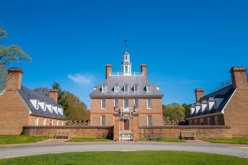 Williamsburg, Virginia, USA: April 13 2022; Beautiful exterior and gardens of the Governor's Palace in the historic town of colonial Williamsburg.