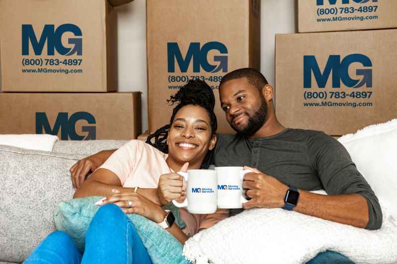relaxed-couple-on-couch-by-boxes