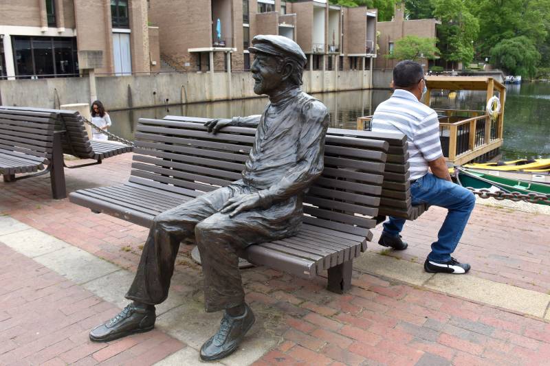state of robert simon sitting on a bench in reston virginia