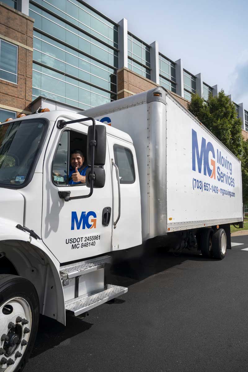 MG Moving employee outside commercial office