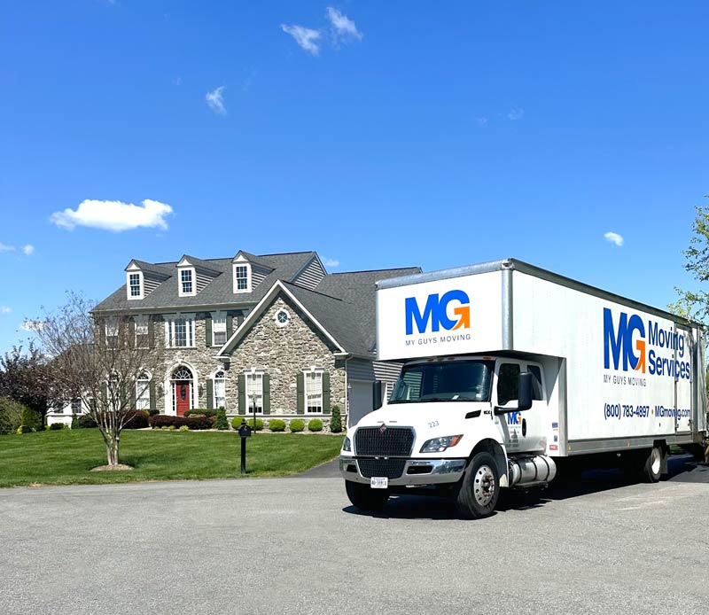 MG Moving truck in residential driveway
