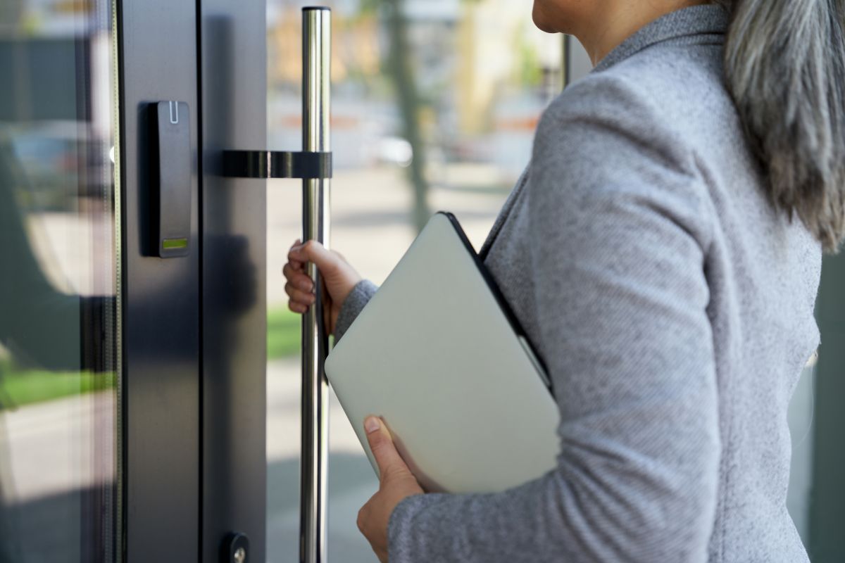 professional checking the key card access of her fob device before a move