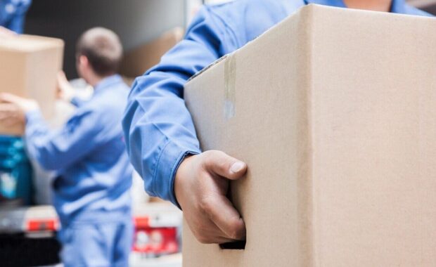 movers unloading a moving van