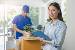 asian women holding the moving checklist