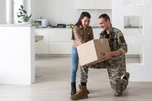 military parents with daughter hugging