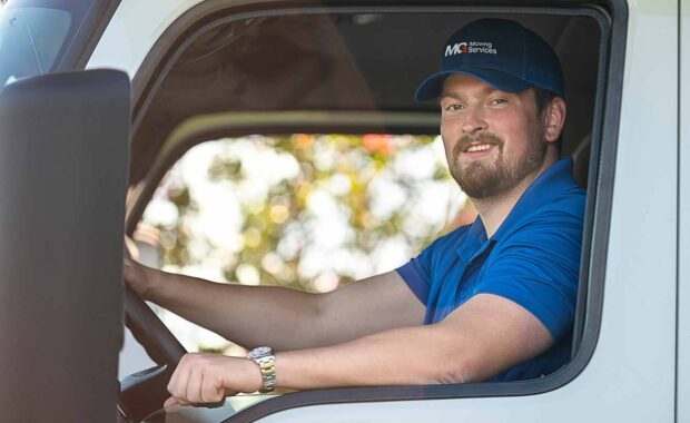 professional mover sitting in a moving truck