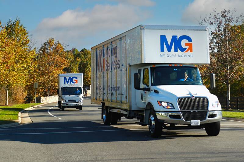 mg moving trucks on the road ready to move