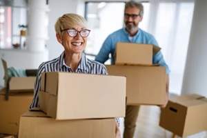 portrait of happy senior couple in love moving in new home