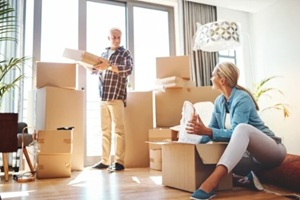 senior couple packing things before moving