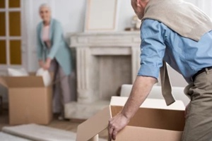 senior man women packing goods in bags