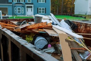 roll-off dumpster filled with building rubble