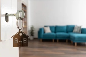 door handle with key and home shaped keychain
