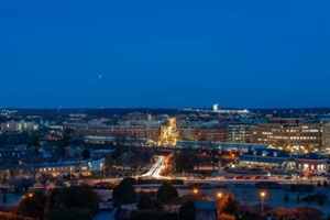 elevated nighttime long exposure photo of the downtown old town alexandria skyline